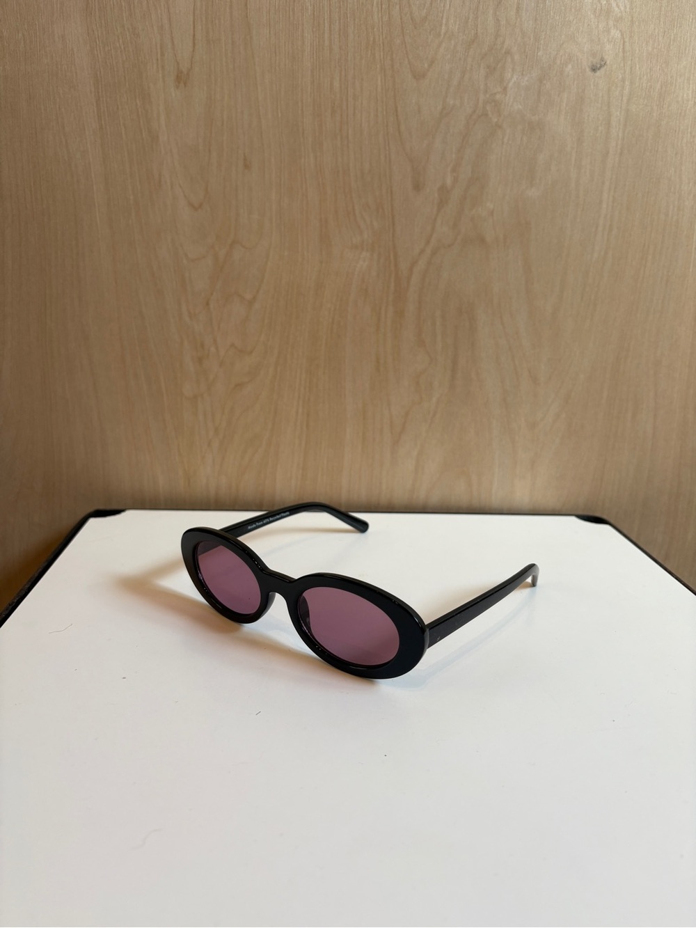 Black frame purple lens sunglasses